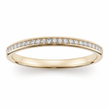 Channel-set half eternity wedding band with round brilliant diamonds