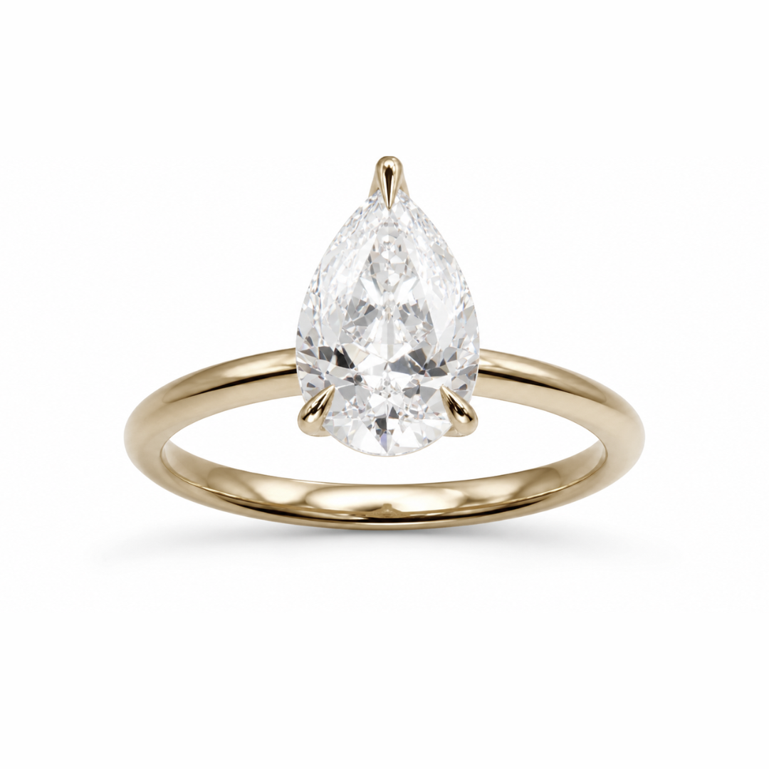 Pear diamond engagement ring in a high profile tulip setting